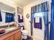 Bathroom with single vanity and updated fixtures at 31748 Parkdale Dr, Leesburg, FL 34748