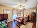 Bedroom with a king-size bed and wood floors at 31748 Parkdale Dr, Leesburg, FL 34748