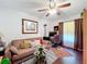 Bedroom with sofa and home office setup at 31748 Parkdale Dr, Leesburg, FL 34748