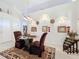Dining area featuring a glass-top table and leopard-print rug at 31748 Parkdale Dr, Leesburg, FL 34748