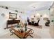 Bright dining area with a glass table and dark brown chairs at 31748 Parkdale Dr, Leesburg, FL 34748