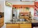 Modern kitchen with stainless steel appliances and granite countertops at 31748 Parkdale Dr, Leesburg, FL 34748