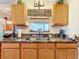 Kitchen features granite countertops and a double sink at 31748 Parkdale Dr, Leesburg, FL 34748