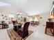 Combined living and dining area with a neutral color scheme at 31748 Parkdale Dr, Leesburg, FL 34748