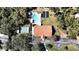 Aerial view of community with clubhouse, pool, and surrounding nature at 3211 Lupine Way, Lake Wales, FL 33898