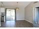 Bright dining room with wood floors and access to porch at 3211 Lupine Way, Lake Wales, FL 33898