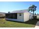 House exterior with screened porch and yard at 3211 Lupine Way, Lake Wales, FL 33898