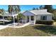 Single story home with carport and landscaped yard at 3211 Lupine Way, Lake Wales, FL 33898