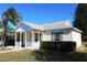 House exterior showcasing front porch and landscaping at 3211 Lupine Way, Lake Wales, FL 33898