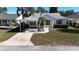 House exterior with carport and landscaped yard at 3211 Lupine Way, Lake Wales, FL 33898