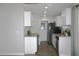 Modern kitchen with stainless steel appliances and white cabinets at 3211 Lupine Way, Lake Wales, FL 33898
