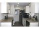 Modern kitchen featuring stainless steel appliances and light-colored cabinetry at 3211 Lupine Way, Lake Wales, FL 33898