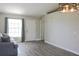 Living room with wood floors, neutral walls, and ample natural light at 3211 Lupine Way, Lake Wales, FL 33898