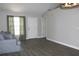Living room with wood floors and neutral walls at 3211 Lupine Way, Lake Wales, FL 33898