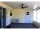 Relaxing screened porch with ceiling fan and seating at 3211 Lupine Way, Lake Wales, FL 33898