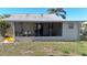 Screened porch with outdoor seating area at 3211 Lupine Way, Lake Wales, FL 33898