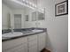 Clean bathroom with double vanity and updated countertops at 33236 Grand Cypress Way, Leesburg, FL 34748