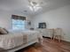 Bedroom with a queen-size bed and plenty of natural light at 33236 Grand Cypress Way, Leesburg, FL 34748