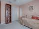 Bedroom with built-in shelving and daybed at 33236 Grand Cypress Way, Leesburg, FL 34748