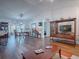 Bright dining room with a wooden table and chairs, adjacent to the living room at 33236 Grand Cypress Way, Leesburg, FL 34748