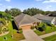 Aerial view of a single-Gathering house with a two-car garage at 3435 Mount Hope Loop, Leesburg, FL 34748