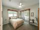 Bedroom with sliding doors to outdoor patio at 4002 Coachshire Way, Mount Dora, FL 32757