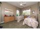 Bright bedroom with two twin beds and neutral decor at 4002 Coachshire Way, Mount Dora, FL 32757