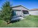 Private backyard with patio, garden, and lush lawn at 409 Rose Croft Ter, The Villages, FL 32162
