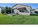 Spacious backyard with a patio and garden area at 409 Rose Croft Ter, The Villages, FL 32162