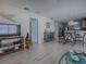 Open living area with decorative elements and views into the dining area at 409 Rose Croft Ter, The Villages, FL 32162