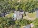 Aerial view showing house, pool, and large yard at 4626 Ne 7Th St, Ocala, FL 34470