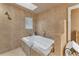 Relaxing bathroom with a large bathtub and skylight at 4626 Ne 7Th St, Ocala, FL 34470