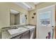 Bathroom with double vanity and granite countertop at 4626 Ne 7Th St, Ocala, FL 34470
