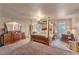 Spacious bedroom with a large four-poster bed and ample dresser space at 4626 Ne 7Th St, Ocala, FL 34470