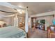 Main bedroom with a four-poster bed and an entertainment center at 4626 Ne 7Th St, Ocala, FL 34470