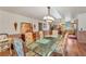 Bright dining room with glass table and hardwood floors at 4626 Ne 7Th St, Ocala, FL 34470