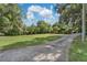 Landscaped front yard with circular driveway at 4626 Ne 7Th St, Ocala, FL 34470