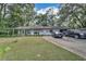 Ranch-style home with covered patio and spacious yard at 4626 Ne 7Th St, Ocala, FL 34470