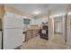 Simple kitchen with white cabinets and black appliances at 4626 Ne 7Th St, Ocala, FL 34470