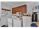 Laundry room with washer, dryer, and cabinets at 4626 Ne 7Th St, Ocala, FL 34470