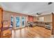 Living room with hardwood floors, sectional sofa, and French doors at 4626 Ne 7Th St, Ocala, FL 34470