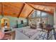 Bright living room featuring wood beams and large windows at 4626 Ne 7Th St, Ocala, FL 34470