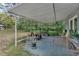 Covered patio with seating area and various plants at 4626 Ne 7Th St, Ocala, FL 34470