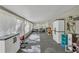 Screened porch with casual seating, storage, and toys at 4626 Ne 7Th St, Ocala, FL 34470