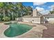 Kidney-shaped swimming pool with a surrounding deck at 4626 Ne 7Th St, Ocala, FL 34470