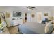 Main bedroom with large dresser and ensuite bathroom at 4809 Magnetite Loop, Mount Dora, FL 32757