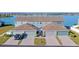 Three-unit townhome building with lake views and garages at 561 Juniper Springs Dr, Groveland, FL 34736
