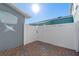 Private backyard with a brick patio and white fence at 561 Juniper Springs Dr, Groveland, FL 34736