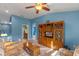Spacious bonus room with vaulted ceilings, a large entertainment center, and comfortable seating at 561 Juniper Springs Dr, Groveland, FL 34736