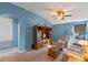 Bright bonus room with vaulted ceilings, large windows, and comfortable seating area at 561 Juniper Springs Dr, Groveland, FL 34736